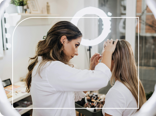 Beauty specialist applying make up to a customer